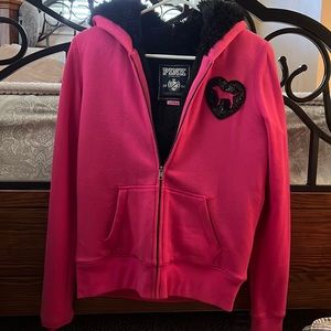 I’m selling a pink Victoria secret coat. The inside is lines with black fur.